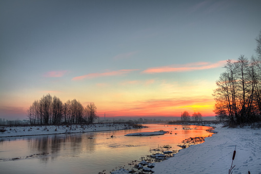 Landscape - sundown in river valley, winter time