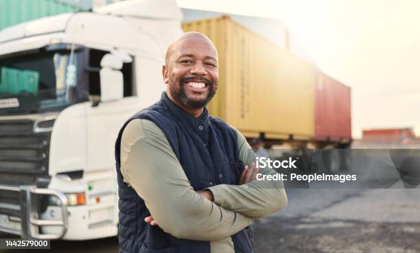 Delivery Container And Happy Truck Driver Moving Industry Cargo And Freight At A Shipping Supply Chain Or Warehouse Smile Industrial And Black Man Ready To Transport Ecommerce Trade Goods Or Stock Stock Photo - Download Image Now