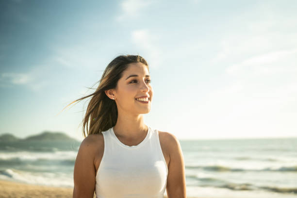 istock Young women contemplating at the beach 1442579563