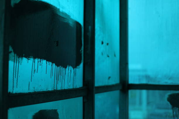 Urla, Turkey - September, 2021: Abandoned two story Aegean house with blue walls.