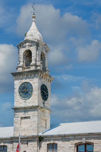 One of a pair of clocktowers at the Royal Naval Dockyard  in Bermuda.  One tells  the time of the next high tide so ships knew when it was best to leave port, this one tells the time.