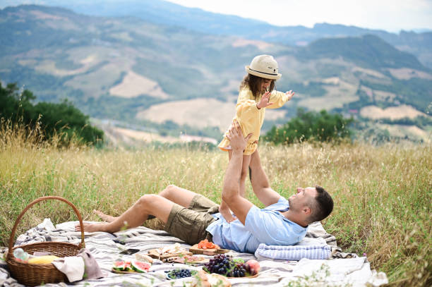 istock Cheerful family enjoying picnic 1442588863