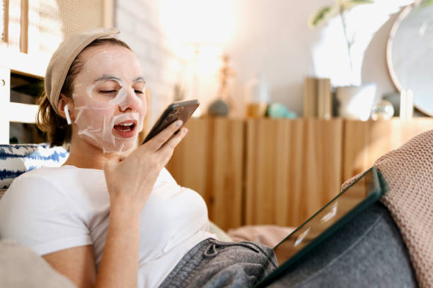 istock Woman relaxing in bed leaving voice messages 1442590457