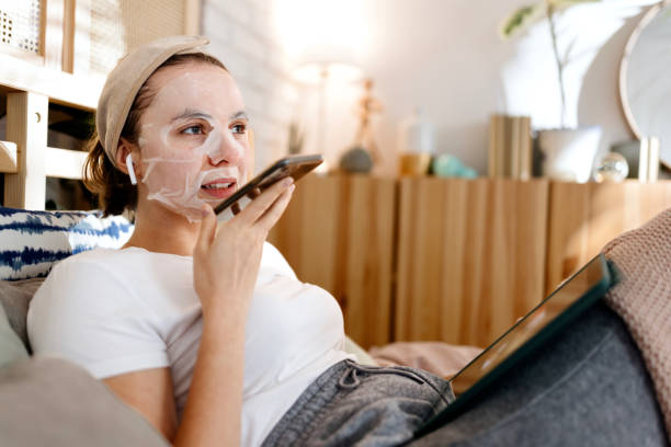 istock Woman relaxing in bed leaving voice messages 1442590461