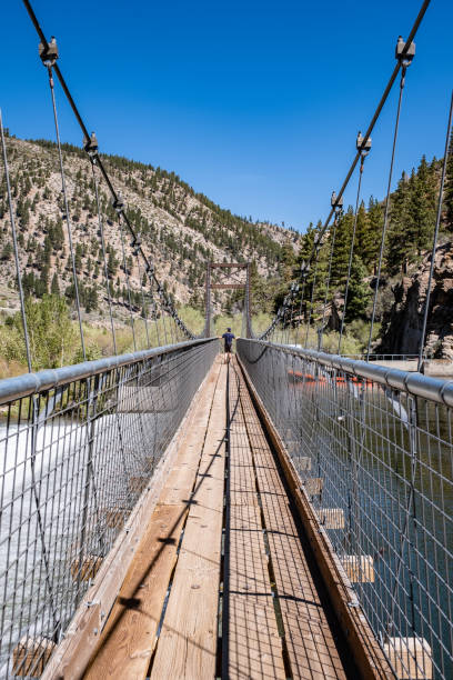 Person Crossing the Fleish Bridge Along the Tahoe-Pyramid Trail stock photo