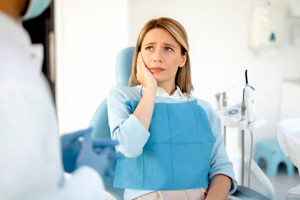 Woman complaining on toothache stock photo