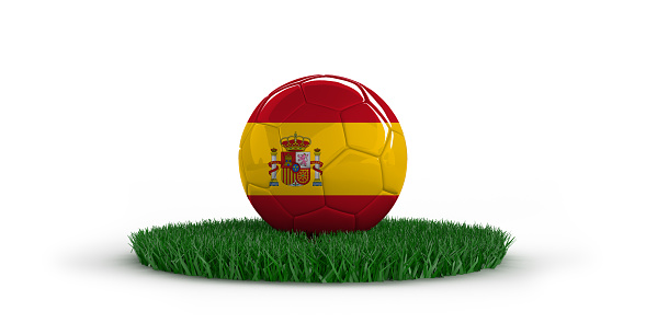 ball in flag of Spain on a bright blurred stadium background.