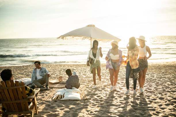 istock Young friends having a picnic at the beach 1442601349