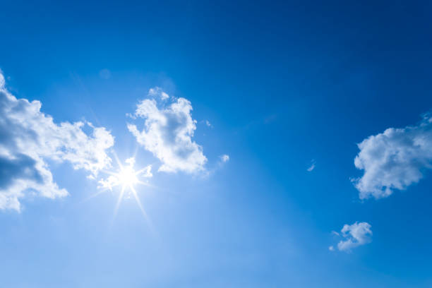 istock sparkle sun on blue cloudy sky, natural sky background 1442602802