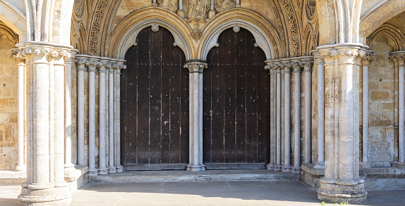 Salisbury Wiltshire, uk, 10, October, 2022 double arched doors and stone columns at the West Front of Salisbury Cathedral