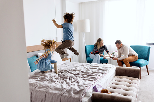 Family in the hotel room, vacation, travel concept