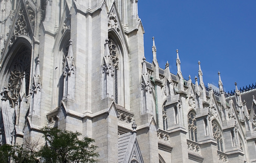 three quarter view of popular NY church from the entrance trancept with bright blue sky