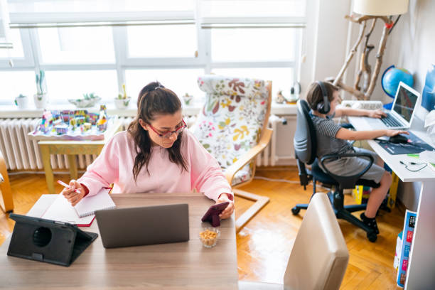 istock Young woman working at home with a kid 1442610487