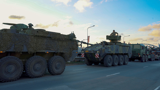 November 18, 2022 NATO Tanks and Soldiers at Military Parade in Riga, Latvia. Military Army soldiers and Crowd With Latvian Flag.