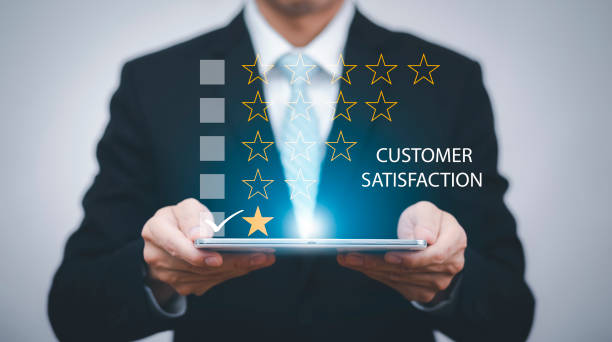 istock Business hold tablet and Customer review satisfaction feedback survey concept, User give rating to service experience on online application, service leading to reputation ranking of business. 1442610716