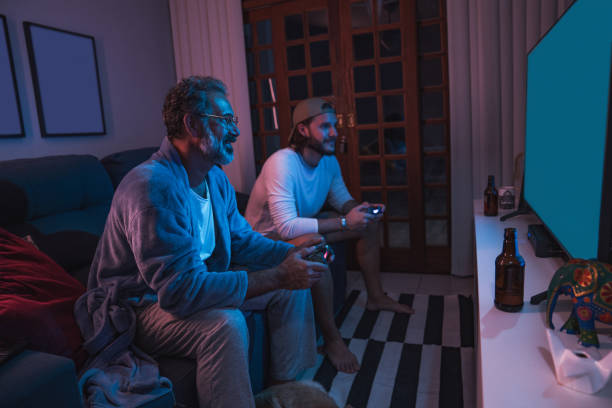 Father and son, video game night . stock photo