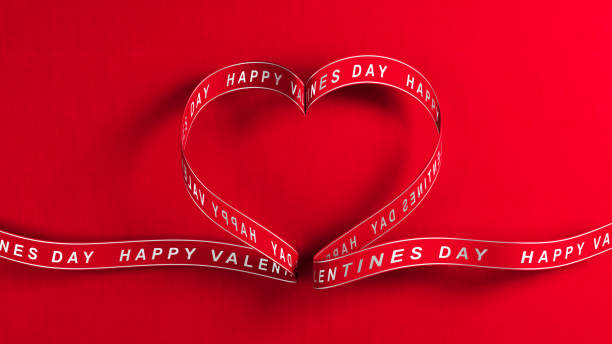 istock Red color heart shaped ribbon with happy valentines text 1442617836