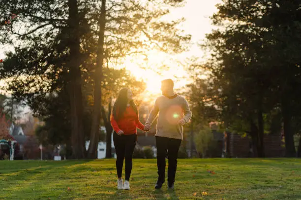 romantic couple in the park with sunset