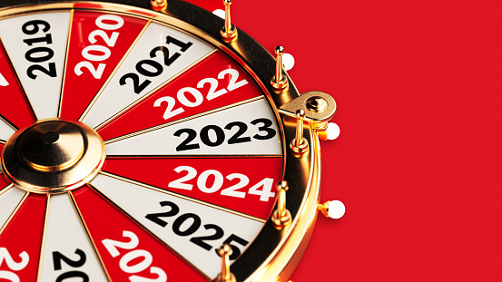 2023 new years concept wheel of fortune with 2023 text on red color background horizontal composition