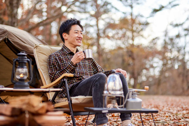 Japanese man enjoying camping