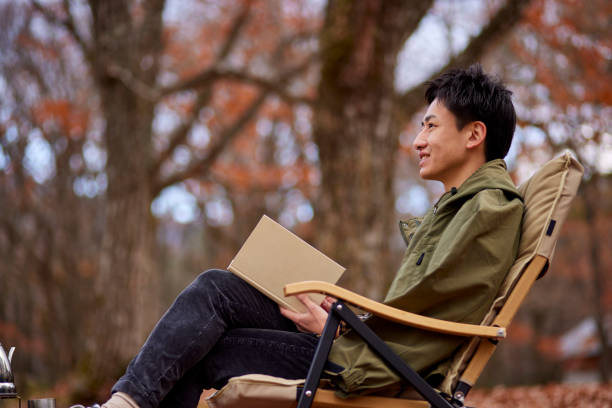 istock Japanese man enjoying camping 1442630455