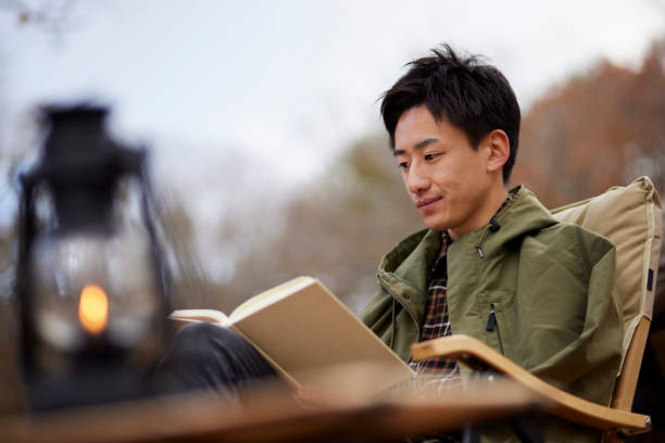 istock Japanese man enjoying camping 1442630456