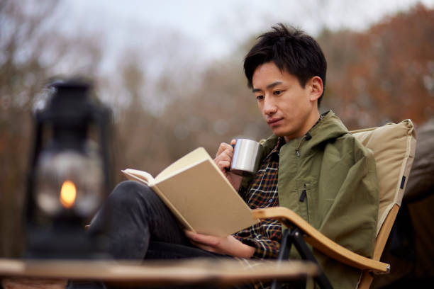 istock Japanese man enjoying camping 1442630470
