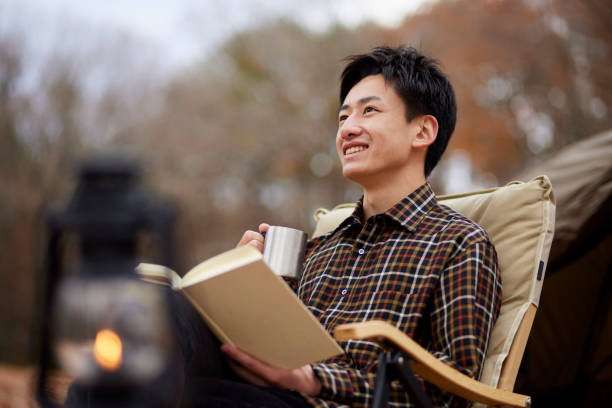 istock Japanese man enjoying camping 1442630473