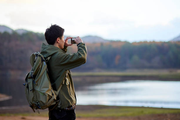 istock Japanese man taking a picture with a smartphone 1442631171
