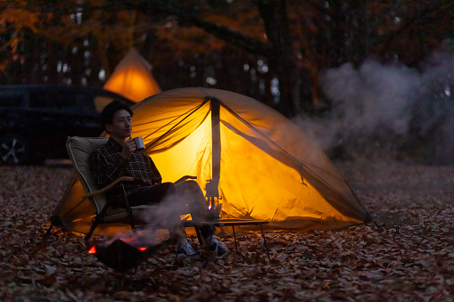 Japanese man enjoying camping