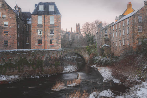 A beautiful afternoon at the historic Dean Village in Edinburgh, Scotland after a fresh winter snowfall.