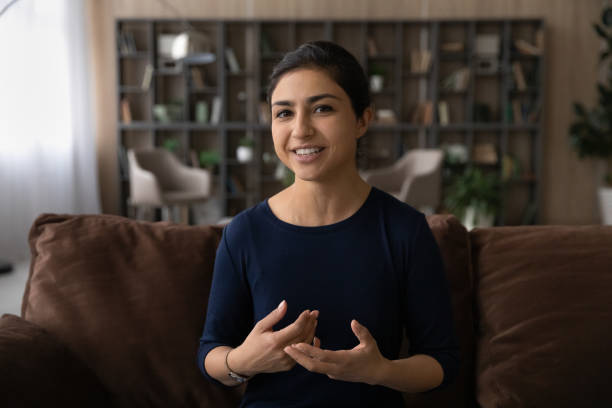 istock Happy young Indian woman talking holding web camera call. 1442639170