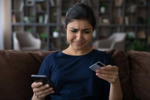 istock Stressed frustrated young Indian woman having problems with internet shopping. 1442639179