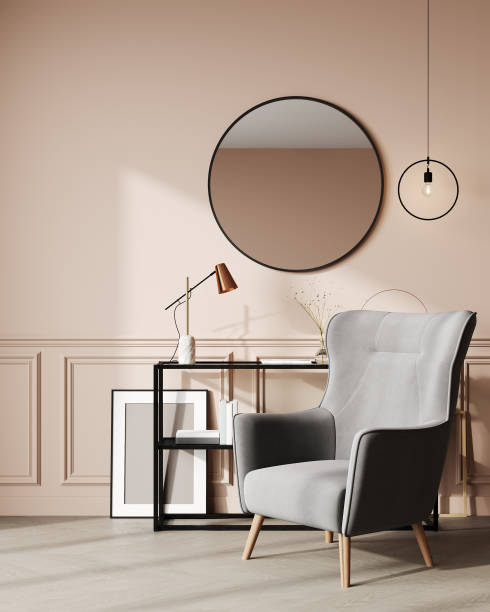 istock Bright interior with classic panel, powder peach wall, lamp, armchair, mirror and decor. 3d render mockup 1442641786