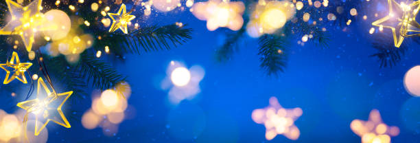istock Christmas Tree Lights - Stars String Hanging At Fir Branches In Abstract Snowy Sky Background 1442642201