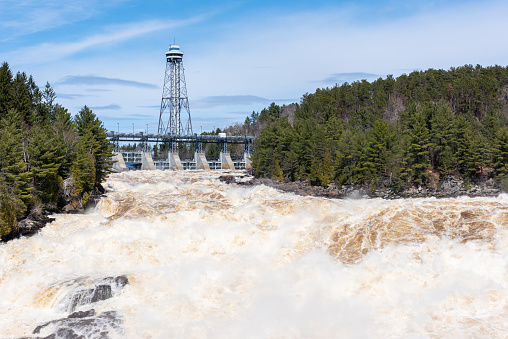 The St Maurice river at the Shawinigan devil’s hole during the spring floods, Quebec, Canada