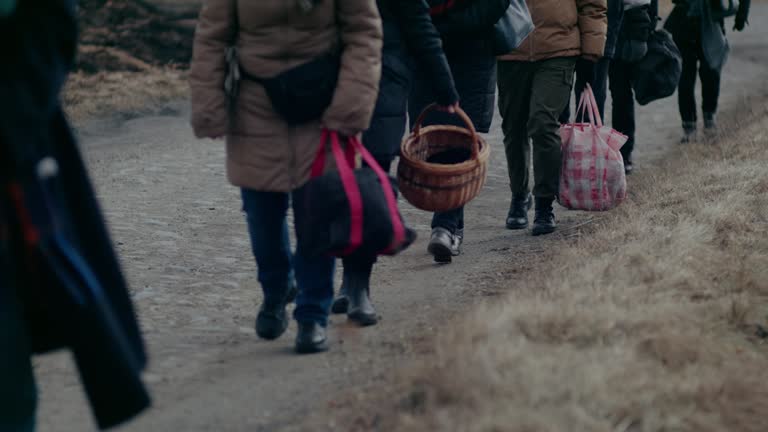 Refugees Walking On Road While Migrating During War.