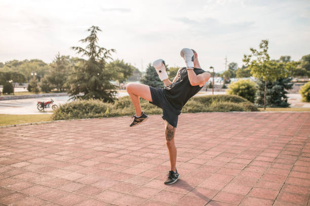 istock A young boxer trains in the park, practicing punches 1442658496