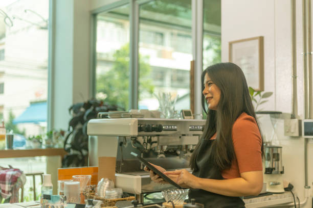 istock Young female coffee shop owner with her services 1442662753
