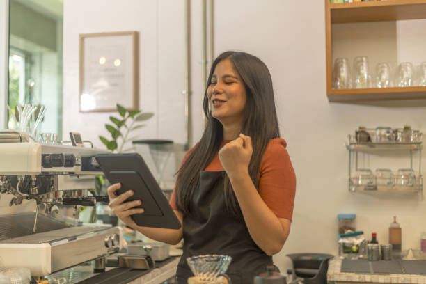 istock Young female coffee shop owner with her services 1442662759