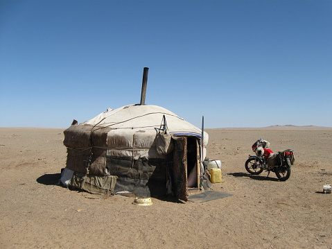 A nomadic family in the middle of nowhere, Ikhkhet of Dornogovi province, Mongolia. The family lives alone in the enormous barren desert. It is so hot and windy.