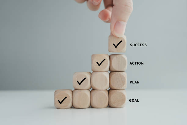 istock Checklist, Task list, Survey and assessment, Quality Control, Goals achievement and business success. To do list. Hand holding check mark from top of step of wooden stacks. 1442665848