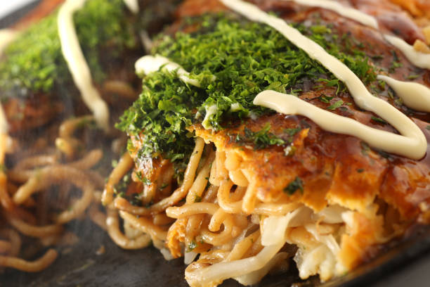 Japanese soul food okonomiyaki Hiroshima style stock photo