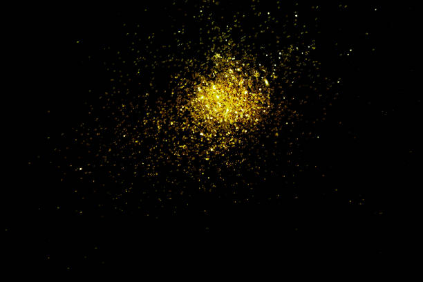 istock Gold glitter powder sparkling on black background.texture christmas 1442674438