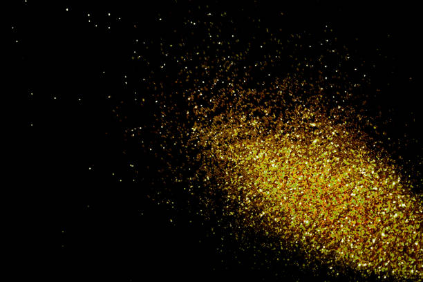 istock Gold glitter powder sparkling on black background.texture christmas 1442674439