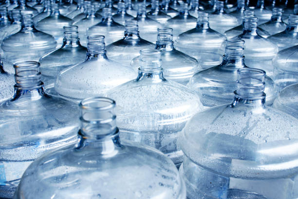 istock Pattern of 19 liter gallon plastic water bottle 1442674616