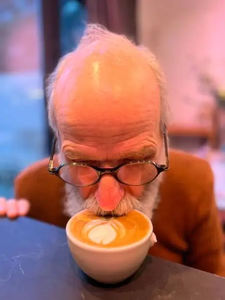 Man is tasting a new brand of coffee