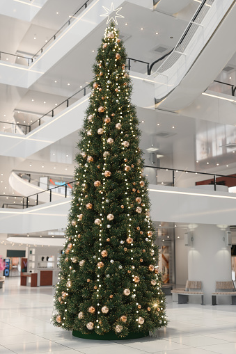 Christmas Tree With Gold Colored Ornaments In Shopping Mall