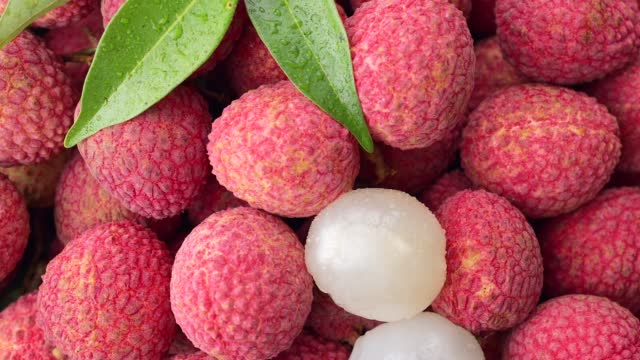 Overhead shot of a rotating heap of ripe lychee