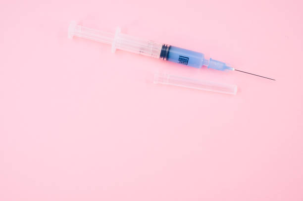 istock isolated sterilized injection syringe on a pink background 1442679637